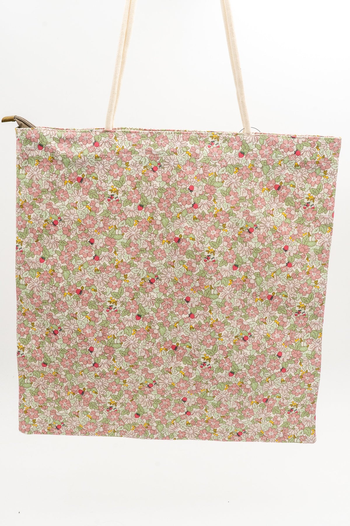 Stoff-Tragetasche mit rosa Blumenmuster und weißen Seilgriffen